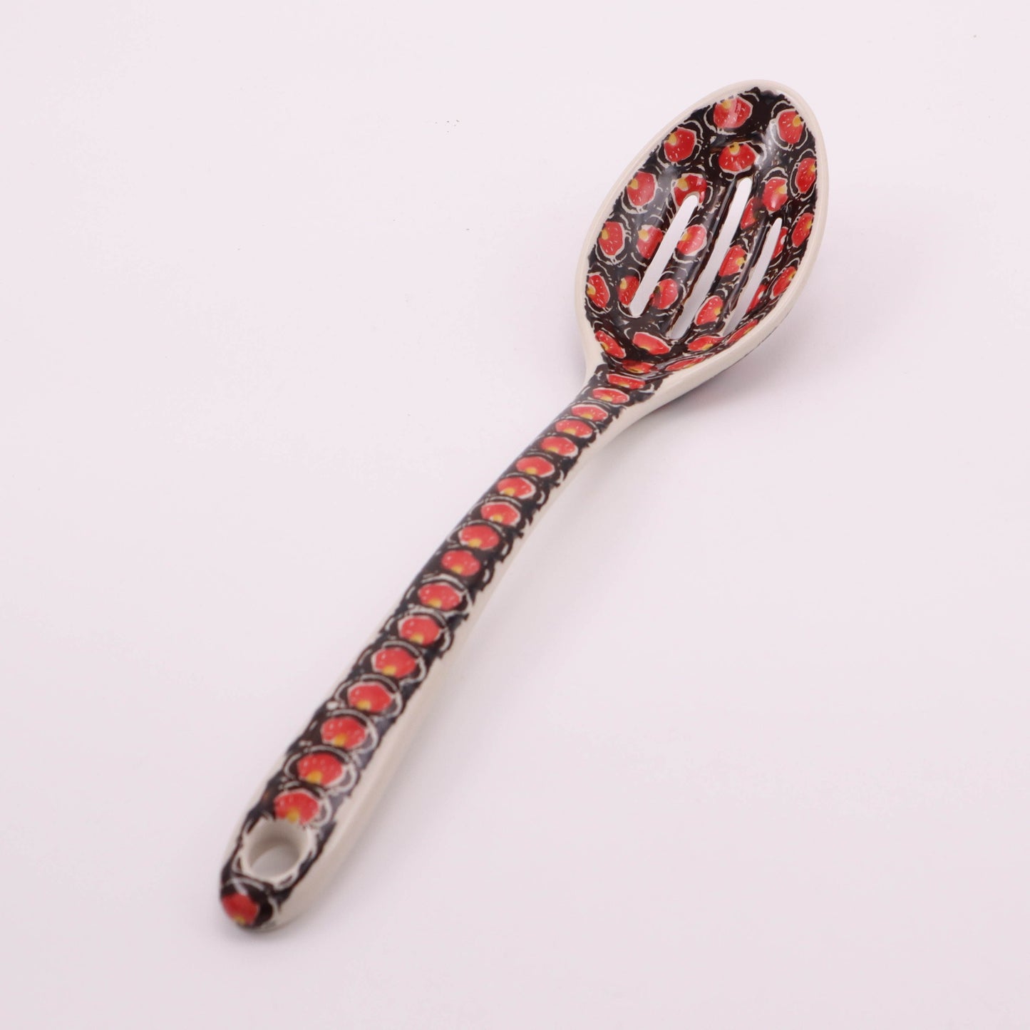 12" Slotted Spoon. Pattern: Merlot